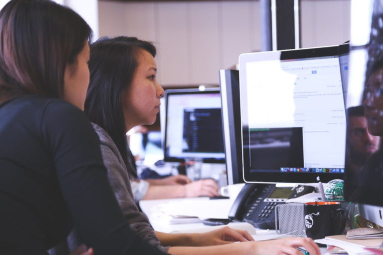 two women at office computer