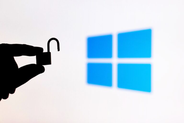 microsoft windows and hand holding open lock