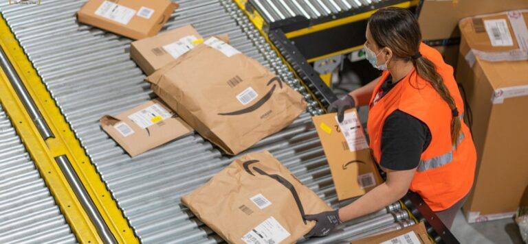 female amazon warehouse worker with many parcels and boxes