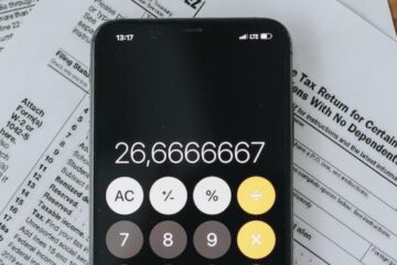 mobile phone calculator on tax documents