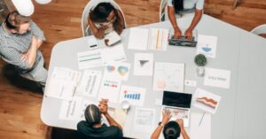 UX and marketing team around desk