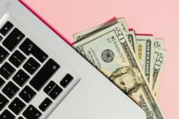 usd money under laptop